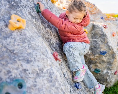 young girl bouldering